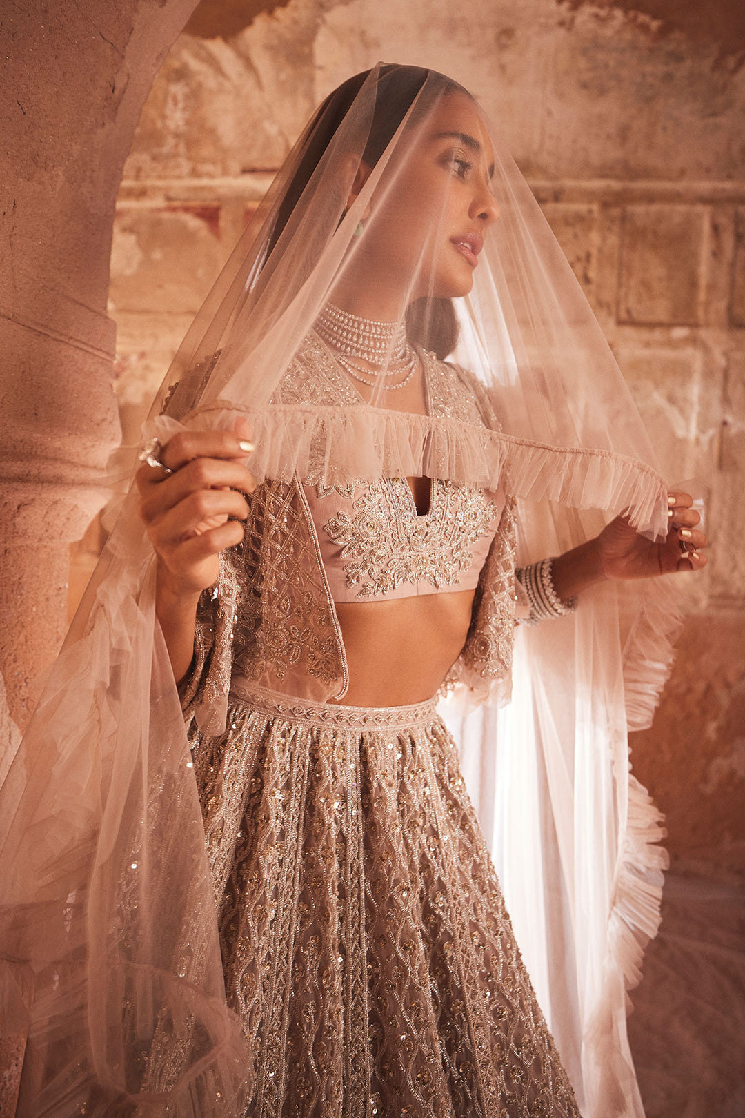 RM-Champagne-Embroidered-Net Cape, Sleeveless Organza Blouse And Net Lehenga