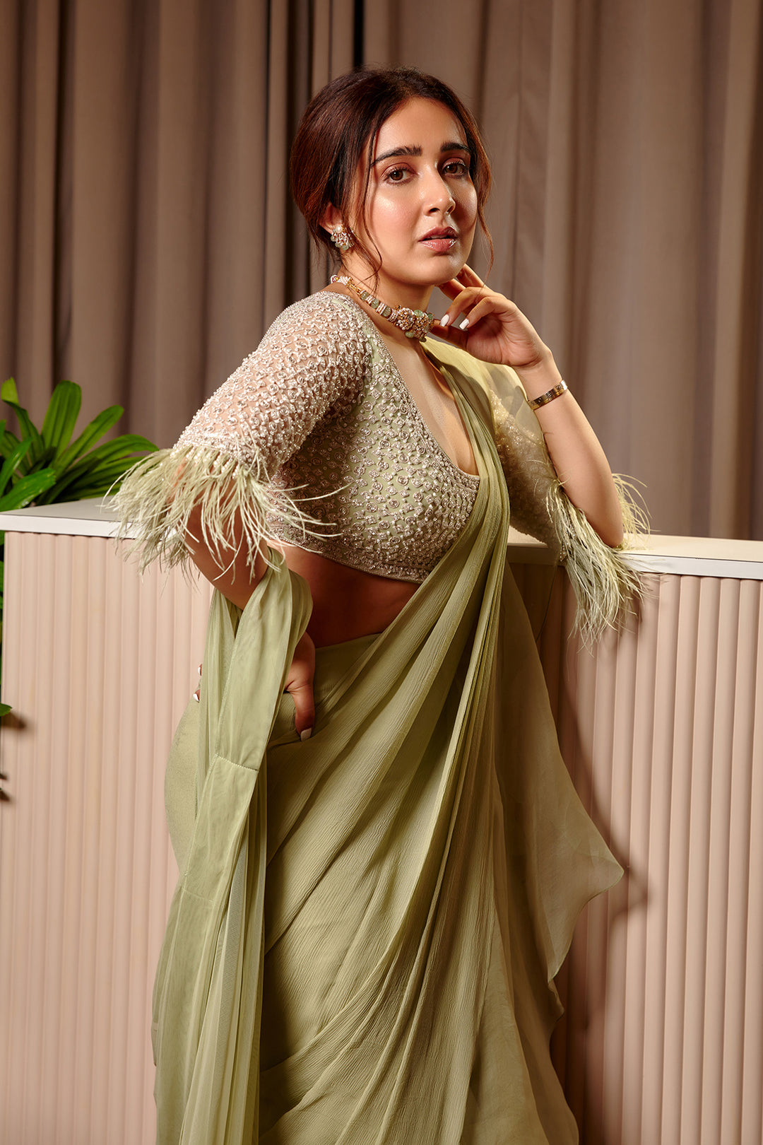 Ridhi-Mehra-Embroidered net blouse with organza chiffon draped saree paired with embroidered belt